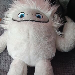 White Stuffed Animal with Fluffy Fur and Blue Eyes